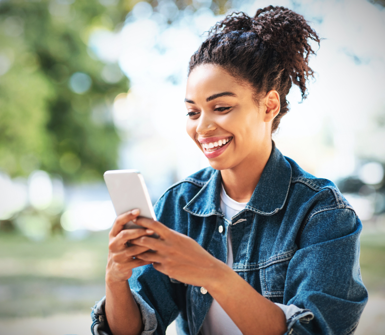 A woman using her phone to book an appointment